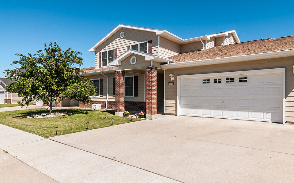 a house with a white garage door in front of it